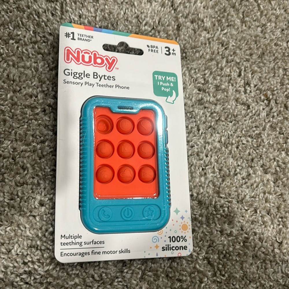 Brand new Nuby Giggle Bytes - 3 months +